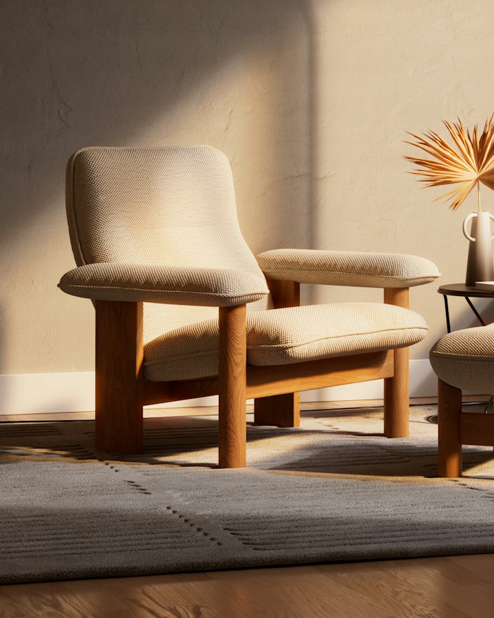 Ren lounge chair in oatmeal bouclé on a white-oak frame, in warm afternoon light